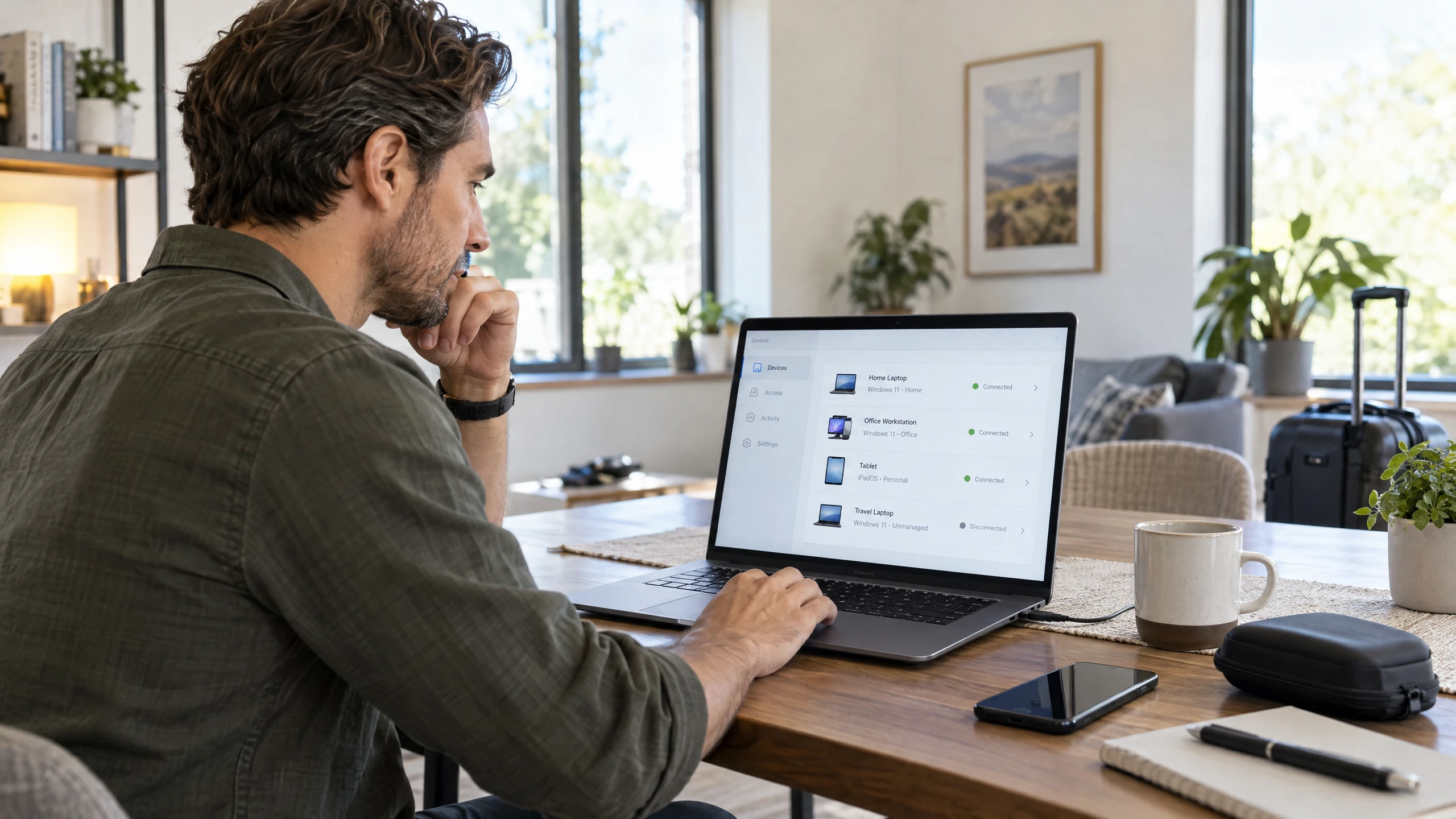 Remote worker using a laptop with a secure dashboard showing approved devices and office and home access sessions (illustrative)