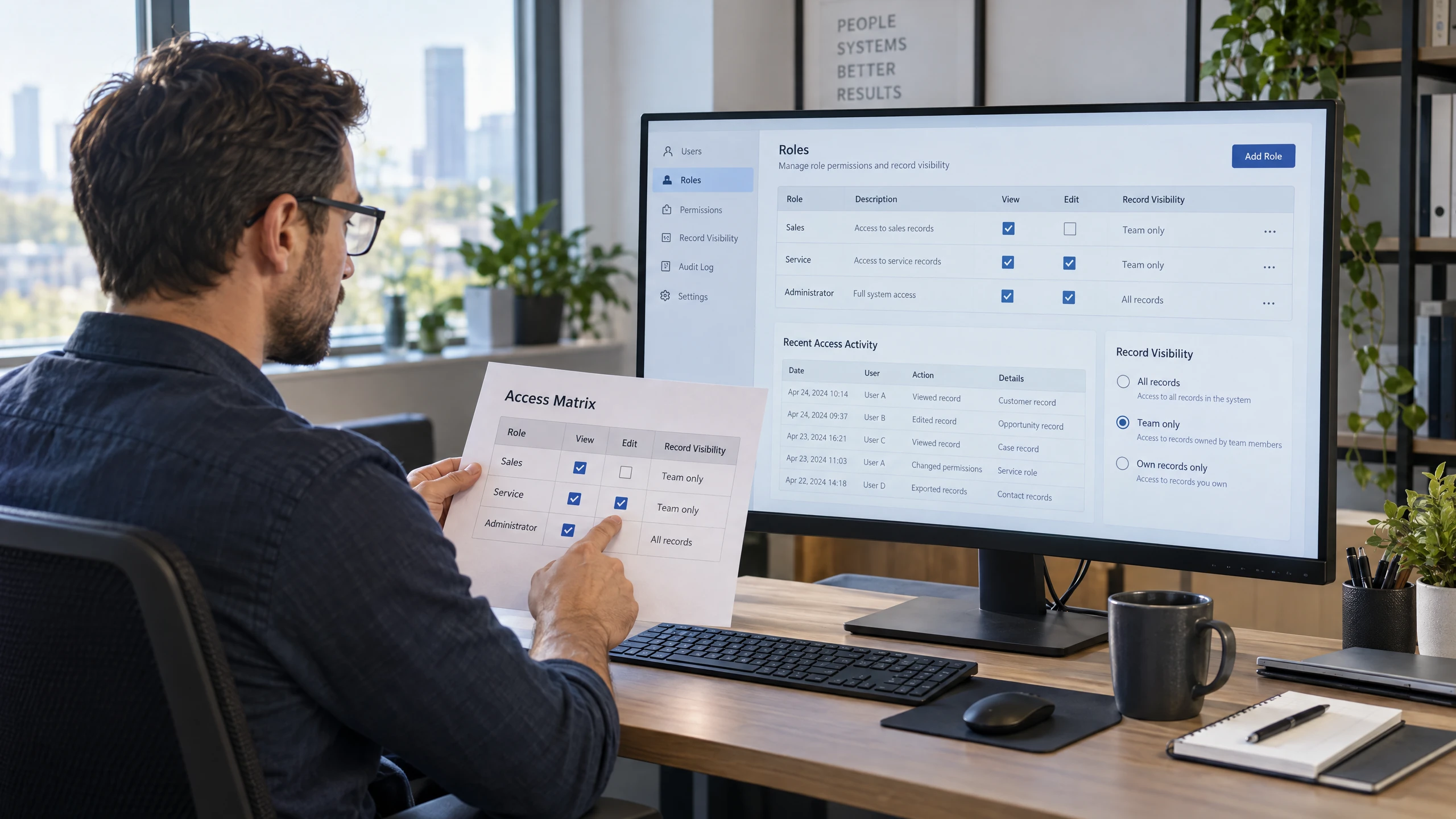 Systems administrator reviewing CRM user roles, record visibility and audit activity controls (illustrative)