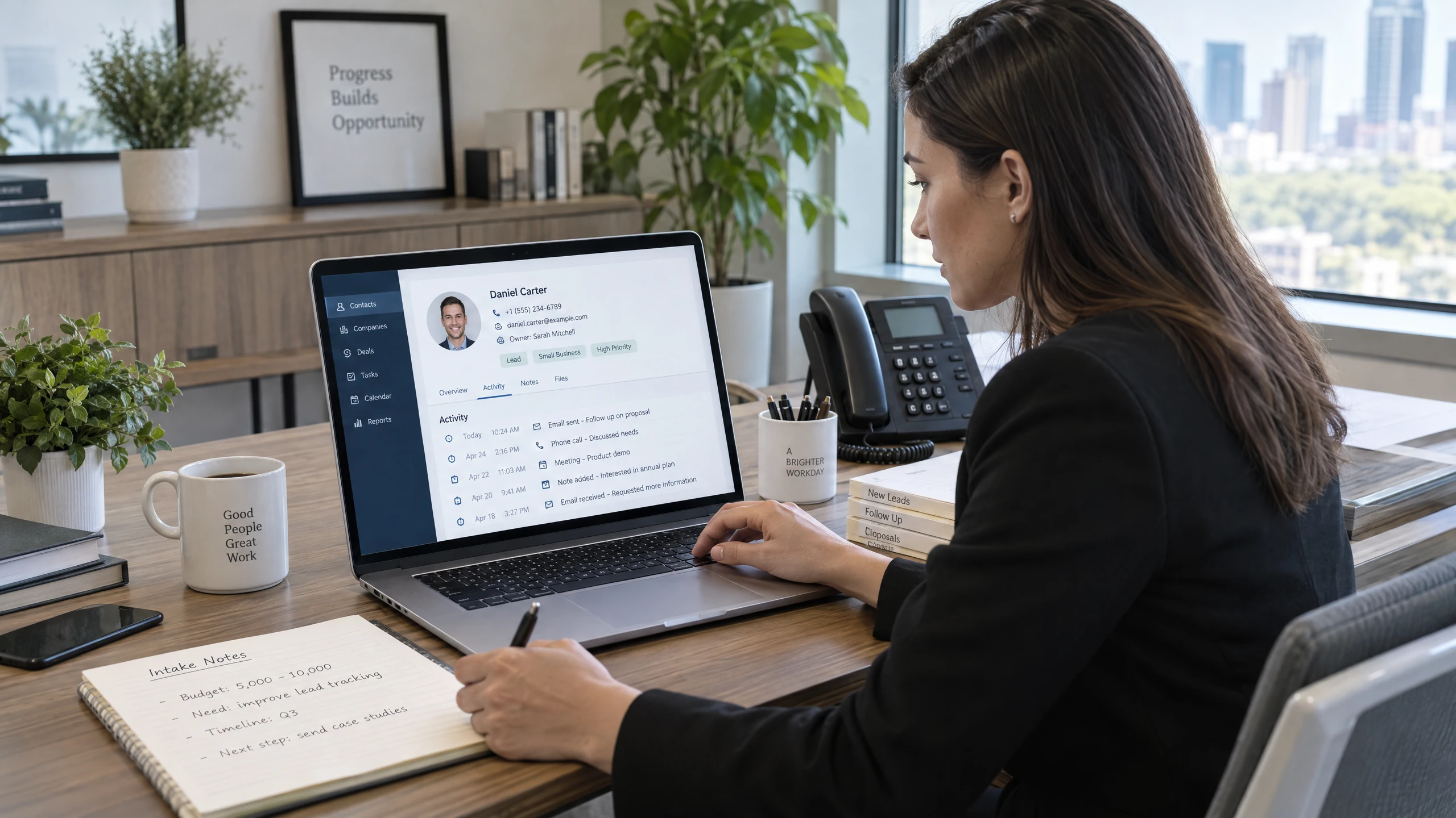 Sales operations specialist reviewing a central contact profile with organised customer details on a laptop (illustrative)