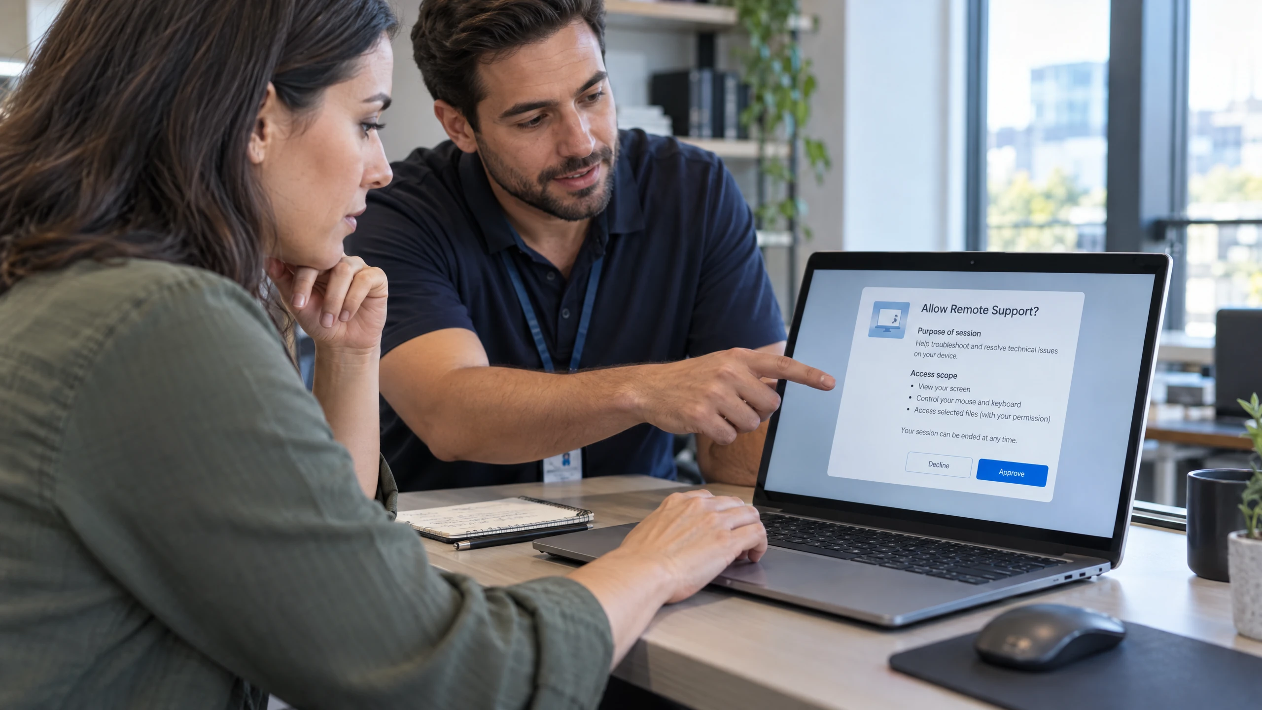 Authorised employee reviewing a generic remote-session consent screen with a support technician before access begins (illustrative)